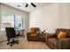 Bright bedroom area with a desk and seating, bathed in natural light at 13300 E Via Linda Dr # 1058, Scottsdale, AZ 85259