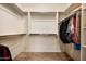 Spacious walk-in closet with ample shelving and hanging storage for organized clothing at 13300 E Via Linda Dr # 1058, Scottsdale, AZ 85259
