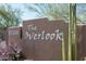 Community sign for The Overlook with desert landscaping and plants at 13300 E Via Linda Dr # 1058, Scottsdale, AZ 85259
