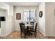 Cozy dining area with a round table and window providing natural light to the space at 13300 E Via Linda Dr # 1058, Scottsdale, AZ 85259