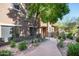 A well-maintained exterior featuring desert landscaping, creating an inviting outdoor space with a tree at 13300 E Via Linda Dr # 1058, Scottsdale, AZ 85259