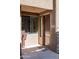Close-up of front door with address number, showing modern design, next to desert landscaping at 13300 E Via Linda Dr # 1058, Scottsdale, AZ 85259