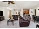 Relax in this spacious living room with a peek into the kitchen and dining areas at 13300 E Via Linda Dr # 1058, Scottsdale, AZ 85259