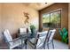 Outdoor dining area on a covered patio with elegant seating and desert views at 13300 E Via Linda Dr # 1058, Scottsdale, AZ 85259