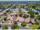 Gorgeous aerial view of a home showcasing mature trees, a swimming pool, and a lovely residential neighborhood at 1470 W Bartlett Way, Chandler, AZ 85248