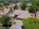 Striking aerial view of a home with a tile roof and mature landscaping at 1470 W Bartlett Way, Chandler, AZ 85248