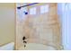 Bright bathroom with tiled shower and tub featuring natural light from high windows at 1470 W Bartlett Way, Chandler, AZ 85248