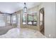 Bright dining area with large windows, neutral color, and tiled floors at 1470 W Bartlett Way, Chandler, AZ 85248