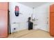 Spacious garage featuring ample cabinet storage, utility sink, and water filtration system for added convenience at 1470 W Bartlett Way, Chandler, AZ 85248