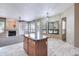 Kitchen with island featuring granite countertops and travertine flooring at 1470 W Bartlett Way, Chandler, AZ 85248
