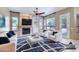 Staged living room with fireplace, cozy decor, and neutral color palette at 1470 W Bartlett Way, Chandler, AZ 85248