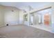 Spacious living room with vaulted ceilings, neutral carpet, and doorway to rooms at 1470 W Bartlett Way, Chandler, AZ 85248