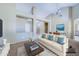 Staged living room with comfortable seating and view of dining area at 1470 W Bartlett Way, Chandler, AZ 85248