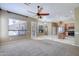 Open floor plan featuring living room and kitchen with stainless steel appliances at 1470 W Bartlett Way, Chandler, AZ 85248