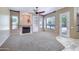 Living room with fireplace, built-in shelving, lots of light, and neutral colors at 1470 W Bartlett Way, Chandler, AZ 85248