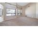 Large living room featuring high ceilings, neutral carpet, and large windows at 1470 W Bartlett Way, Chandler, AZ 85248