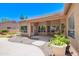 Covered patio with stone and concrete landscaping and large potted plants at 1470 W Bartlett Way, Chandler, AZ 85248