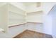 Walk-in closet featuring built-in shelving and racks for optimal storage and organization at 1470 W Bartlett Way, Chandler, AZ 85248