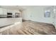 This great room features gray-toned wood-look floors and natural light at 15041 W Gray Fox Trl, Surprise, AZ 85387