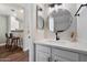 Modern bathroom with a round mirror and white vanity, offering a stylish and clean aesthetic at 1505 N Center St # 218, Mesa, AZ 85201