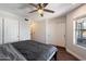 Cozy bedroom with ceiling fan, hardwood flooring, and ample closet space at 1505 N Center St # 218, Mesa, AZ 85201