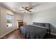 Comfortable bedroom with a ceiling fan and a window letting in natural light at 1505 N Center St # 218, Mesa, AZ 85201