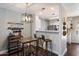Dining area shows modern light fixture, table, and convenient barstool seating at 1505 N Center St # 218, Mesa, AZ 85201