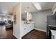 Bright kitchen features white cabinets and open layout to living area at 1505 N Center St # 218, Mesa, AZ 85201