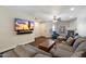 Relaxing living room with mounted TV, fireplace, and cozy seating at 1505 N Center St # 218, Mesa, AZ 85201