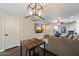 Open living area with modern lighting, TV, and comfortable seating at 1505 N Center St # 218, Mesa, AZ 85201