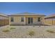 The back of this home has minimal landscaping with private patio at 16762 W Alameda Rd, Surprise, AZ 85387