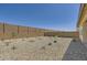 Large backyard featuring low-maintenance desert landscaping and block wall fence, perfect for outdoor entertaining at 16762 W Alameda Rd, Surprise, AZ 85387