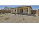 Backyard with minimal landscaping, private patio, and a view of the home's back exterior at 16762 W Alameda Rd, Surprise, AZ 85387
