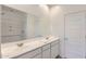 Bright bathroom with a double sink vanity and tiled shower/tub at 16762 W Alameda Rd, Surprise, AZ 85387