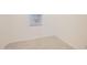 The bedroom features bright natural light from a window, neutral walls, and carpet flooring at 16762 W Alameda Rd, Surprise, AZ 85387