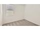 Bedroom featuring neutral carpet and a window for natural light at 16762 W Alameda Rd, Surprise, AZ 85387