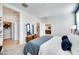 Bright bedroom featuring neutral tones, walk-in closet, and an ensuite bathroom at 16762 W Alameda Rd, Surprise, AZ 85387
