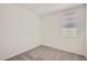 Bedroom featuring neutral carpet and a window for natural light at 16762 W Alameda Rd, Surprise, AZ 85387