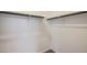 Walk-in closet with wooden clothing rods and white shelving at 16762 W Alameda Rd, Surprise, AZ 85387