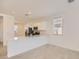 Beautiful kitchen featuring white cabinets, stainless steel appliances, and a breakfast bar for casual dining at 16762 W Alameda Rd, Surprise, AZ 85387