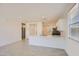 Modern kitchen featuring white cabinets, breakfast bar and stainless steel appliances in an open concept living space at 16762 W Alameda Rd, Surprise, AZ 85387