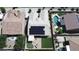 Drone view of the backyard showcasing the pool, putting green, and solar panels at 16785 W Montana De Oro Dr, Surprise, AZ 85387