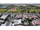 Aerial view of the neighborhood showcasing community parks and this home with solar panels at 16785 W Montana De Oro Dr, Surprise, AZ 85387