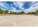 Outdoor basketball court surrounded by mature trees, perfect for sports and recreation at 16785 W Montana De Oro Dr, Surprise, AZ 85387