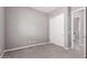 Carpeted bedroom with a closet and en-suite bathroom at 16785 W Montana De Oro Dr, Surprise, AZ 85387