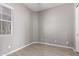 Bedroom with tile floors, window and white door at 16785 W Montana De Oro Dr, Surprise, AZ 85387