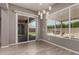 Elegant dining area with sliding glass doors and decorative pendant lighting at 16785 W Montana De Oro Dr, Surprise, AZ 85387