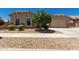 Charming single-story home with desert landscaping, stone accents, and a two-car garage at 16785 W Montana De Oro Dr, Surprise, AZ 85387