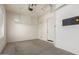 Clean garage with a door to outside and ceiling storage racks at 16785 W Montana De Oro Dr, Surprise, AZ 85387