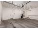 A large garage with installed ceiling storage racks at 16785 W Montana De Oro Dr, Surprise, AZ 85387